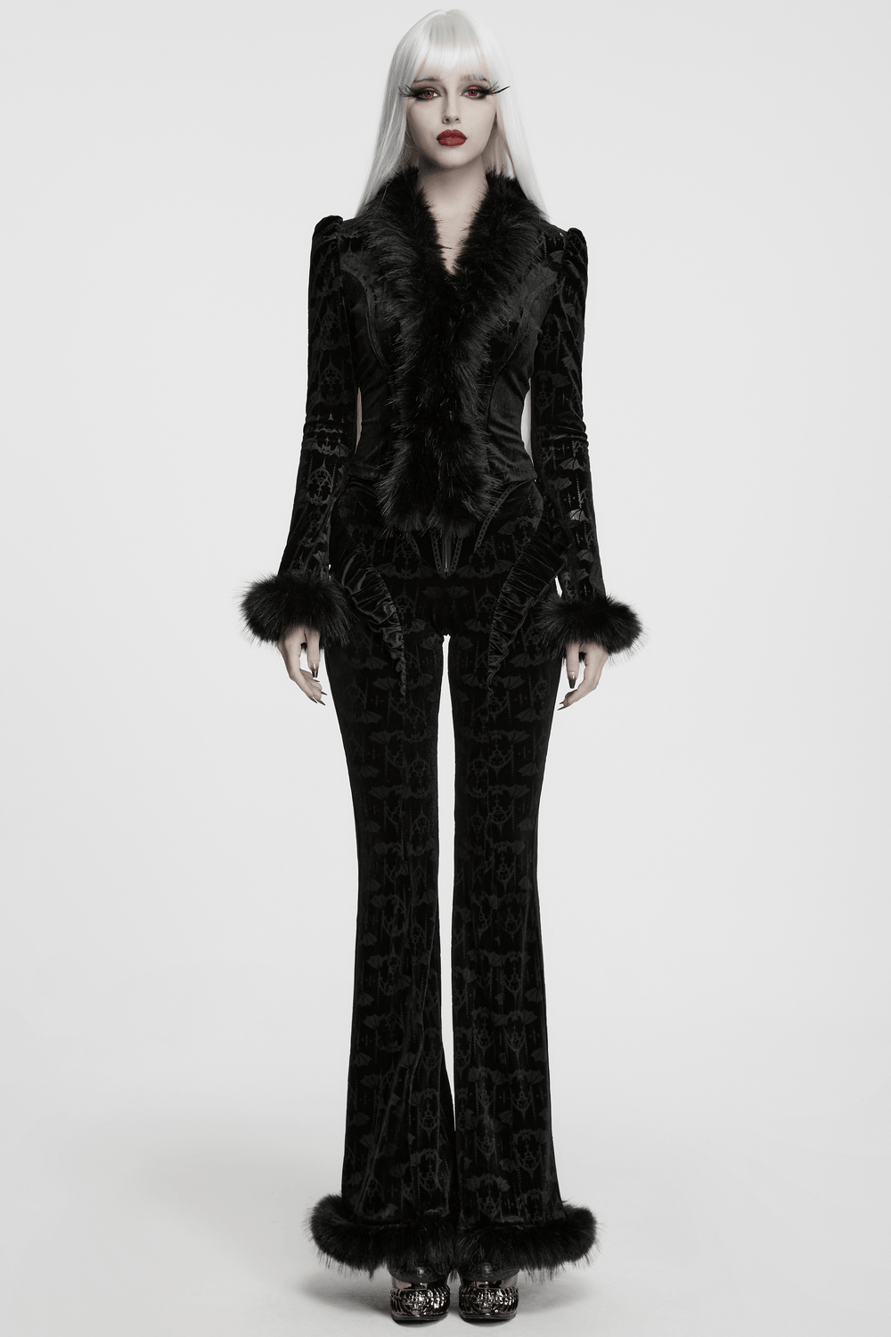 Gothic Bat Pattern Flared Pants with Ruffled Waist showcased in a dramatic black velvet outfit with faux fur trim.