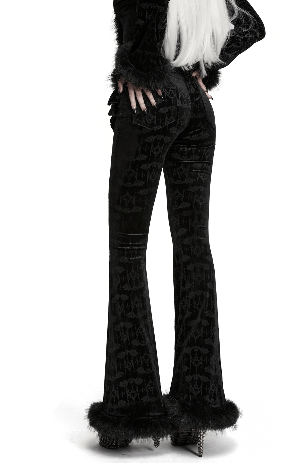 Gothic Bat Pattern Flared Pants with Ruffled Waist featuring dramatic ruffled hip panels and faux fur trim.