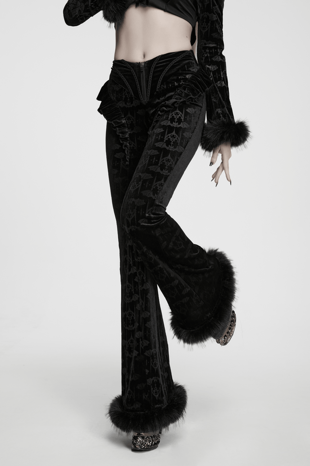 Gothic Bat Pattern Flared Pants with Ruffled Waist features plush faux fur trim and a striking bat pattern silhouette.