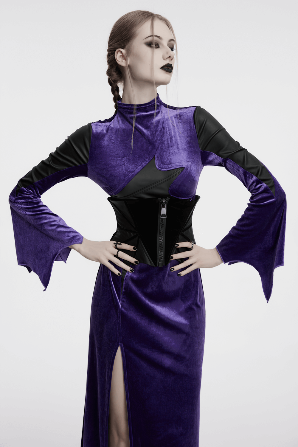 Model wearing a gothic bat corset belt with velvet and PU panels, styled in dark fashion.