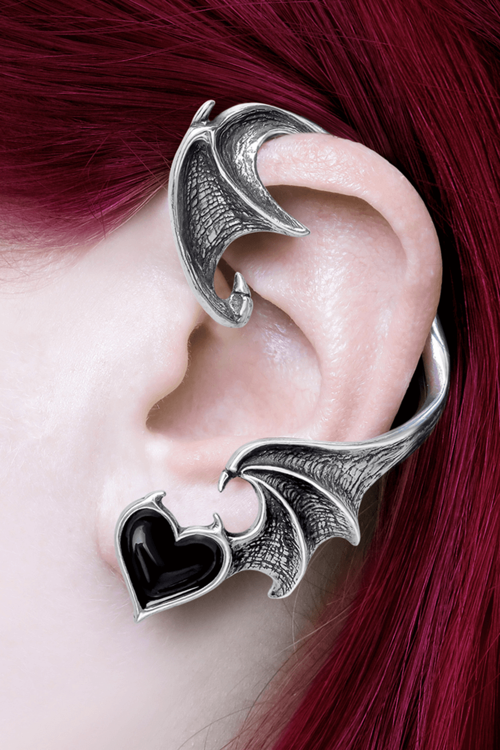Gothic Bat Wing Earwrap with Black Heart Jewel Accent adorning a model's ear, showcasing dark elegance.