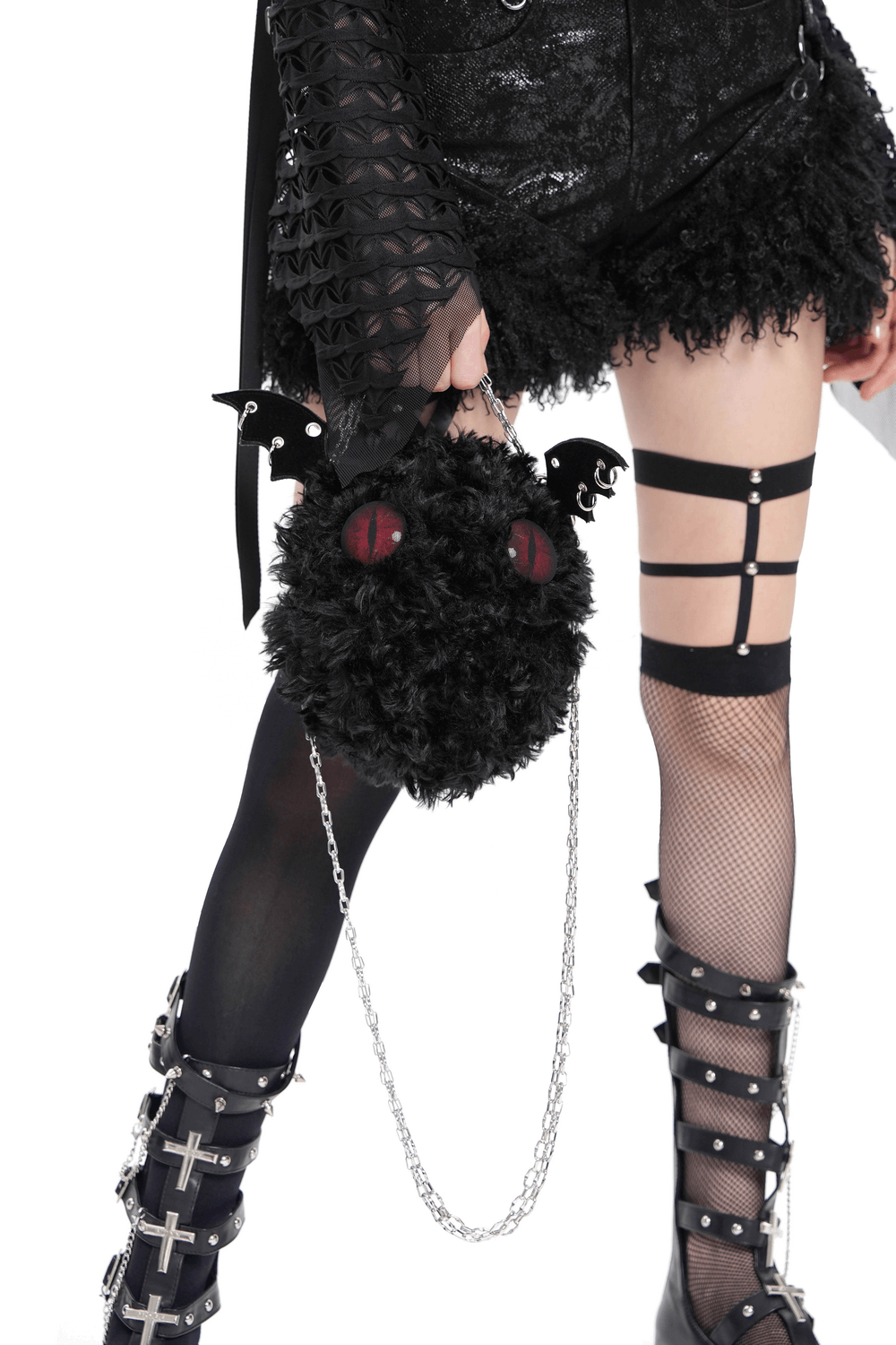 Gothic bat wing plush shoulder bag with red eyes, silver chain, and alternative punk fashion details.