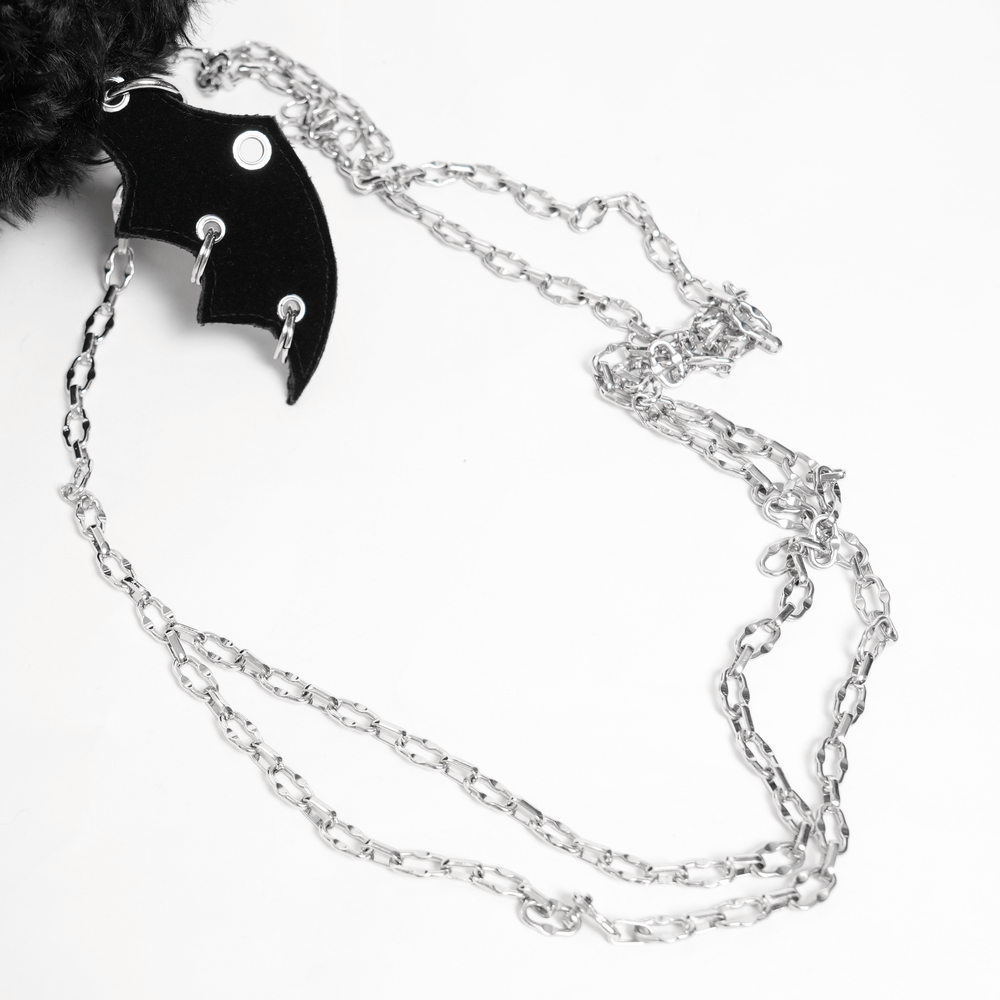 Close-up of bat wing charm and silver chain strap for Gothic Bat Wing Plush Shoulder Bag.