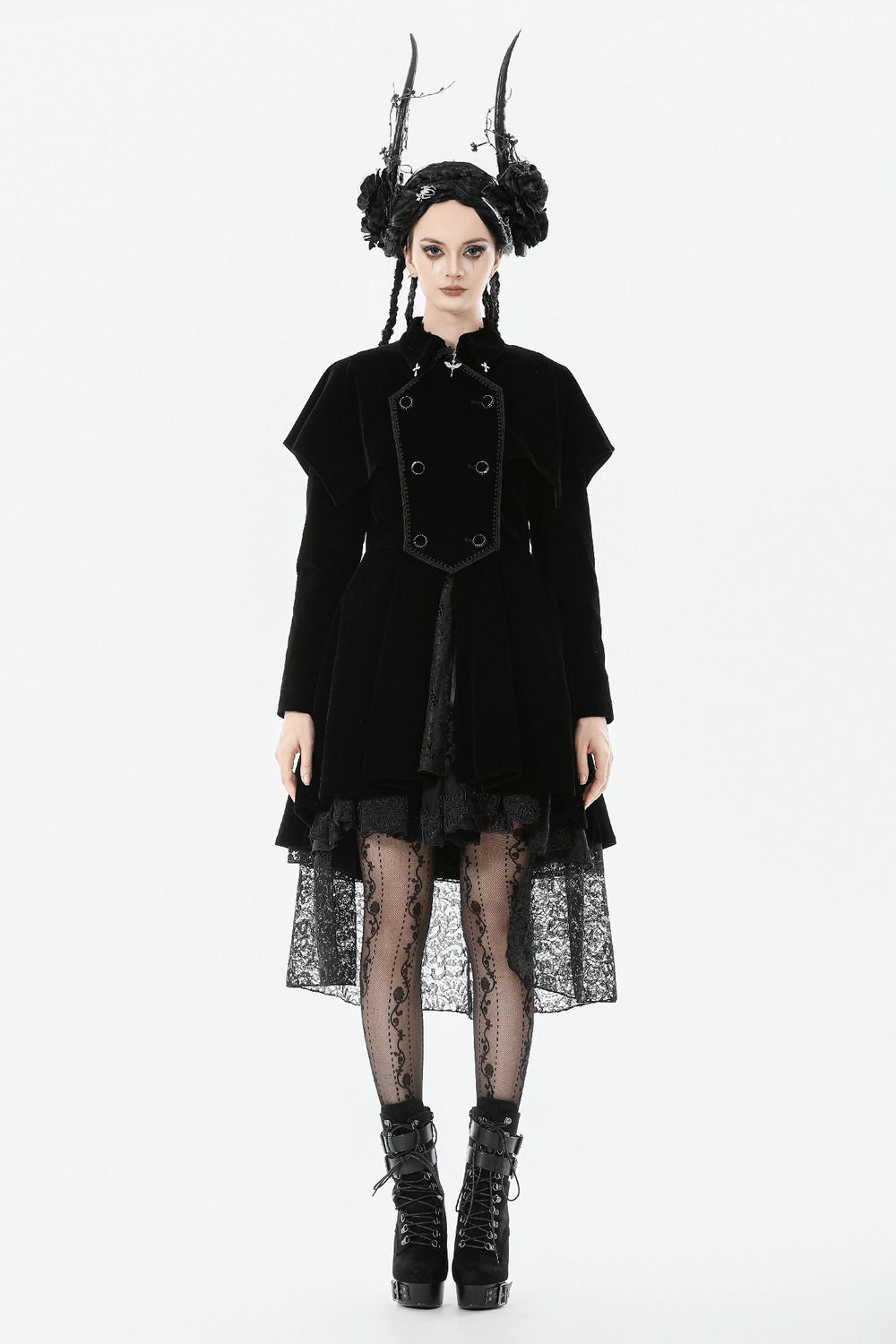 Gothic Bat-Winged Velvet Coat with Cross Collar Detail on a model with dramatic accessories and lace stockings.