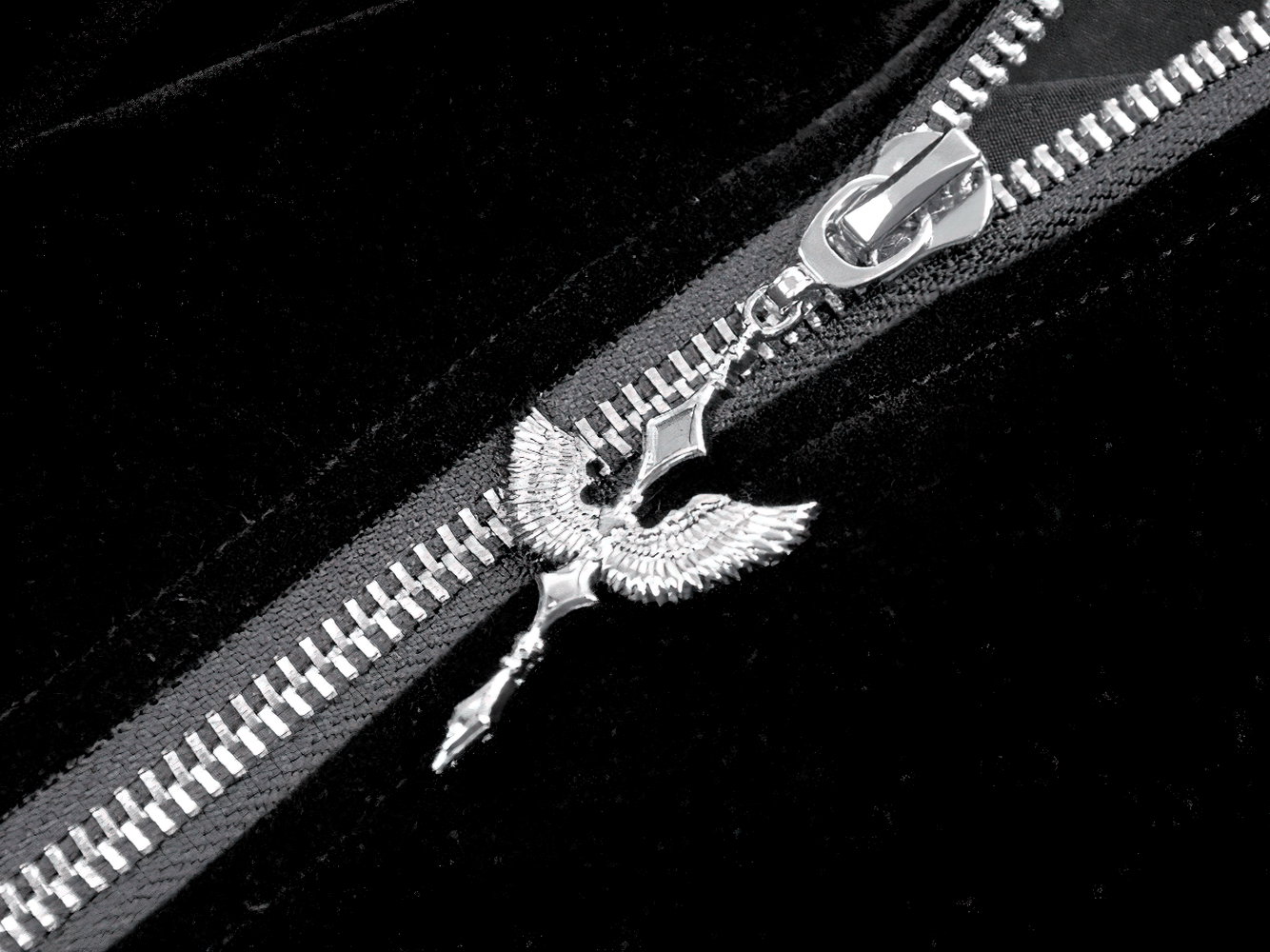 Gothic Bat-Winged Velvet Coat with Cross Collar Detail featuring silver winged zipper pull and elegant black velvet fabric.