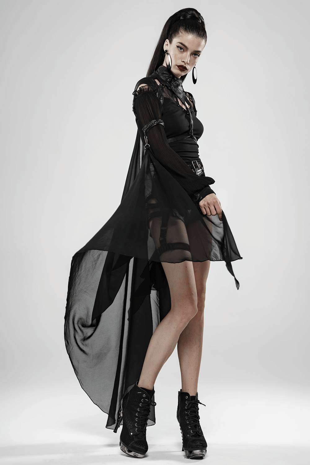 Model showcasing a Gothic Batwing Cape with cracked PU leather and chiffon, exuding dark elegance in a stylish pose.