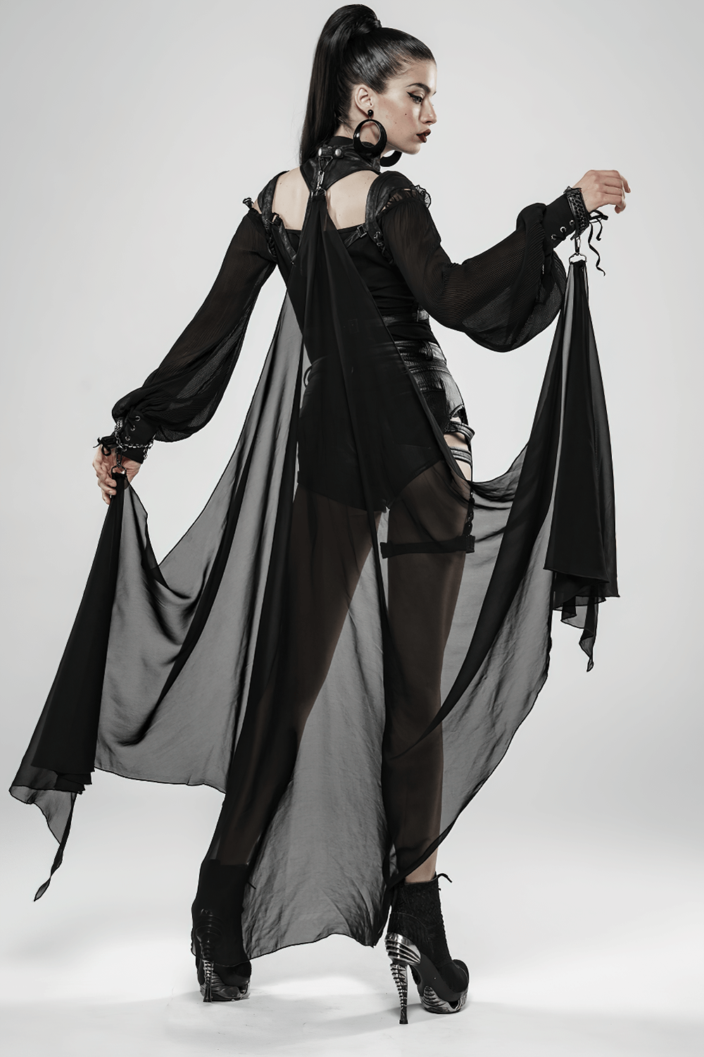 Model showcasing a Gothic Batwing Cape with cracked PU leather and flowing chiffon in an elegant dark style.