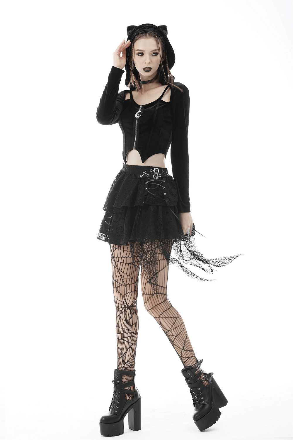 Gothic model wearing a stylish black batwing hoodie with cat ears and layered skirt, showcasing edgy fashion.