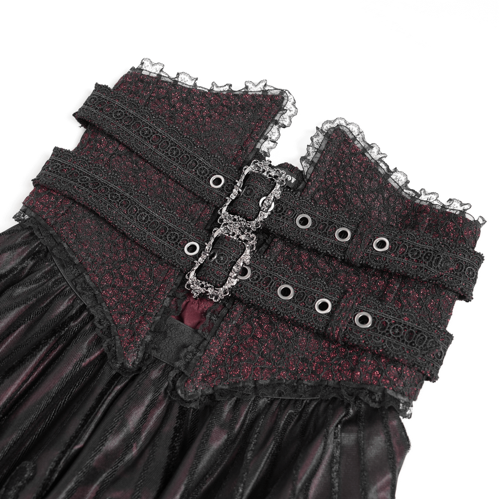 Close-up of gothic black and burgundy maxi skirt featuring ornate buckle straps and lace detailing.