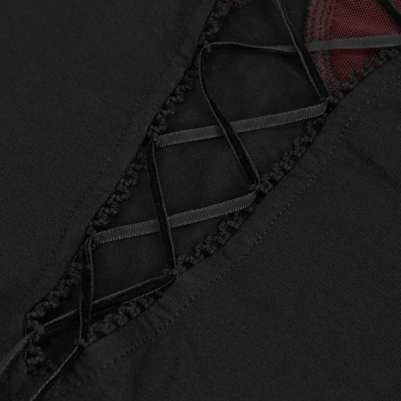 Close-up of gothic black off-shoulder top showcasing intricate lace detailing and rich red accents.