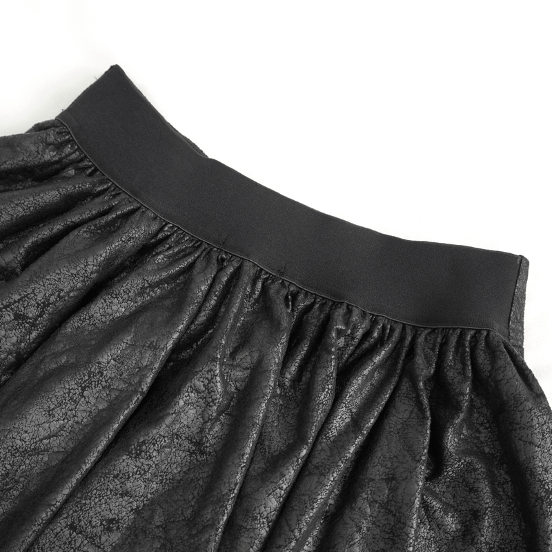 Close-up of the waistband of a gothic black and red splicing irregular skirt with a gathered texture.