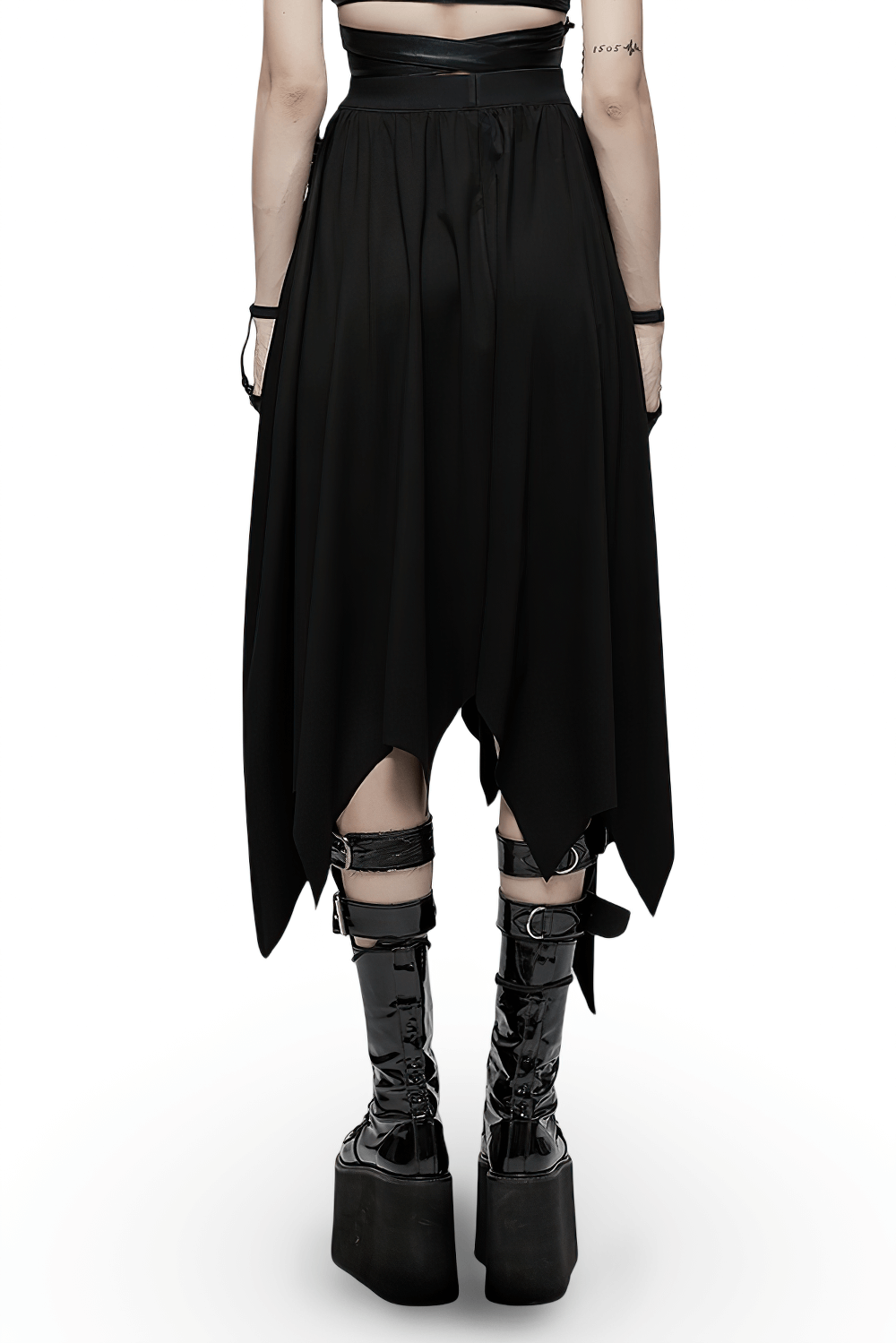 Black asymmetrical long skirt with bat hem, featuring a buckle waist and edgy streetwear style.