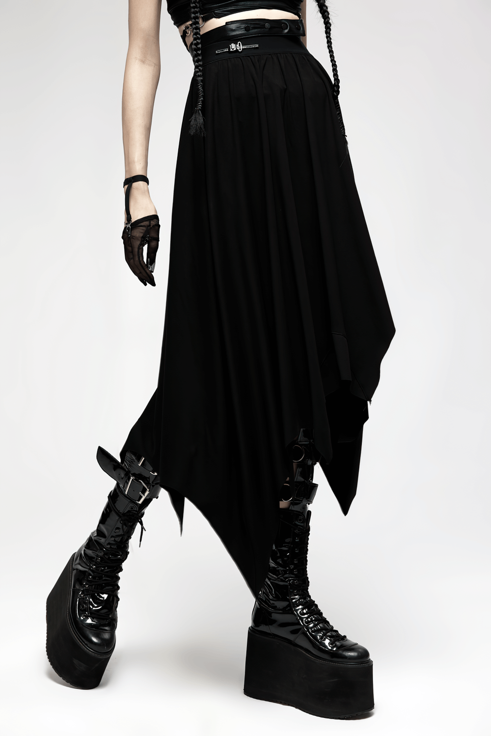 Gothic black asymmetrical long skirt with buckle waist and bat hem, styled with platform boots.