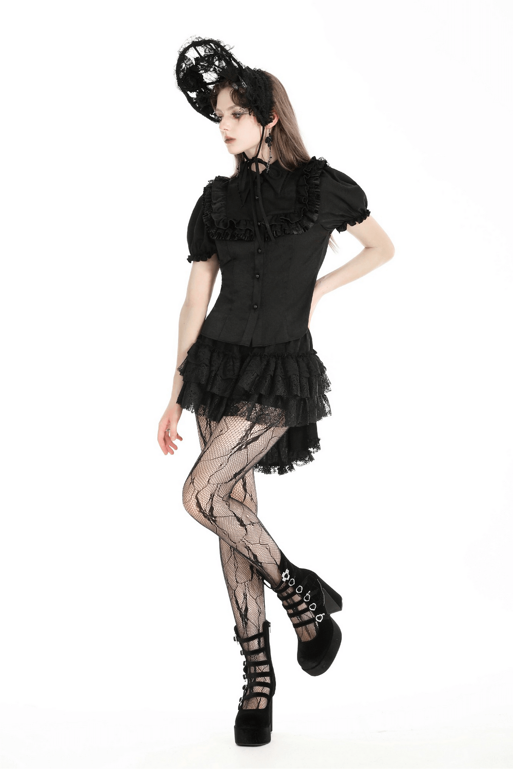 Victorian-inspired black blouse with puff sleeves, ruffle detailing, and stylish lace tights for a dramatic look.
