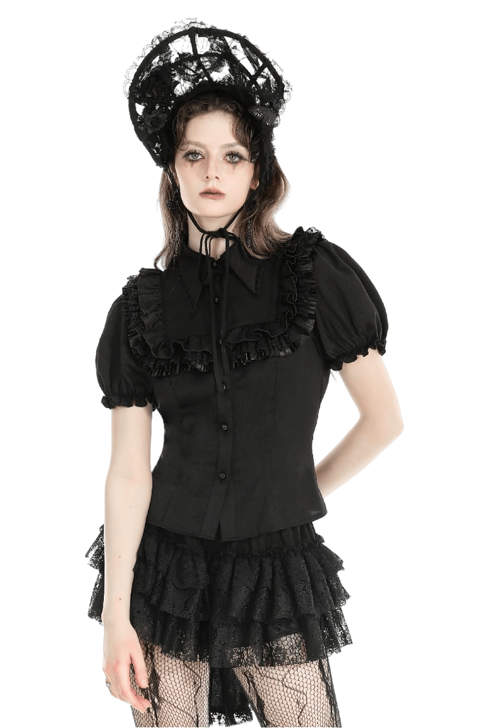 Gothic Victorian black blouse with puff sleeves, ruffle details, and stylish accessorized outfit.
