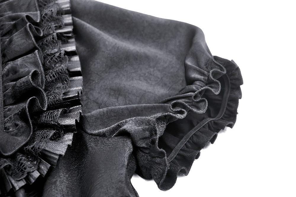 Elegant black puff sleeve blouse with ruffle detail, showcasing Victorian-inspired design and dramatic flair.