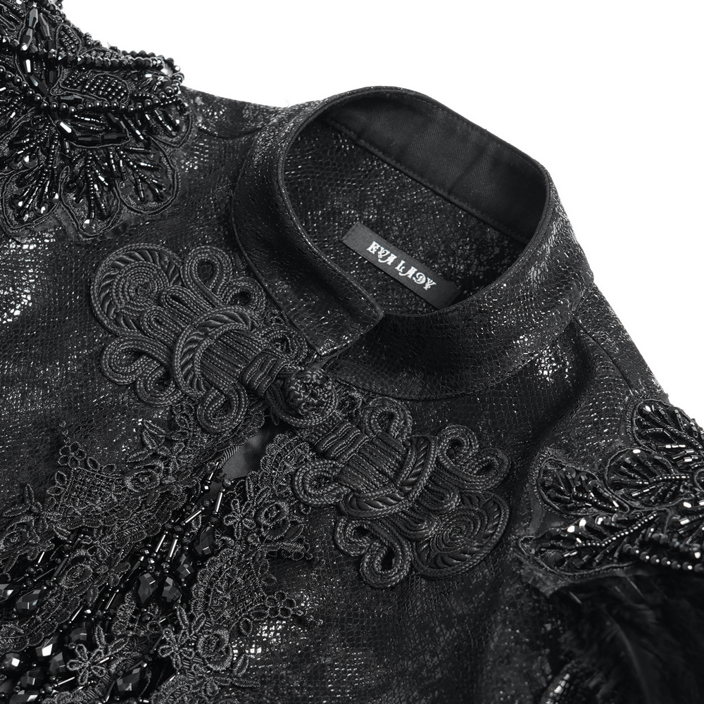 Close-up of a gothic black bolero shrug, showcasing intricate lace and bead details on an elegant collar.