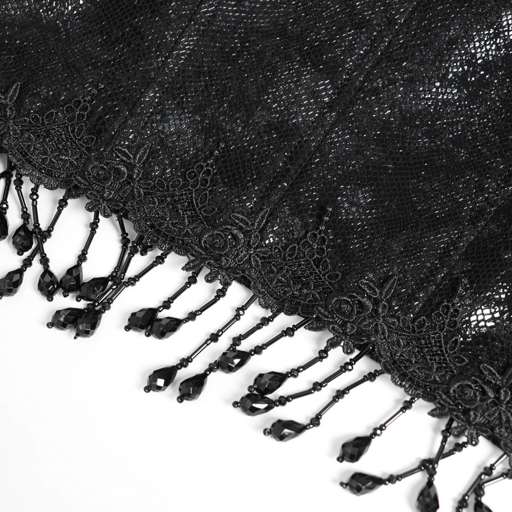 Close-up of intricate black lace with elegant beaded tassels, perfect for gothic and Victorian fashion.