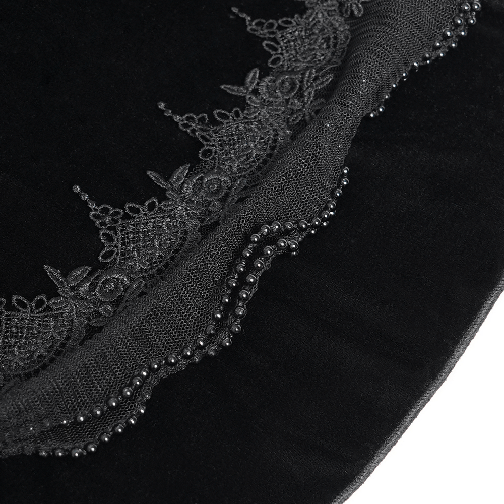 Close-up of intricate lace trim and bead detailing on a gothic black bolero shrug, showcasing dark elegance.