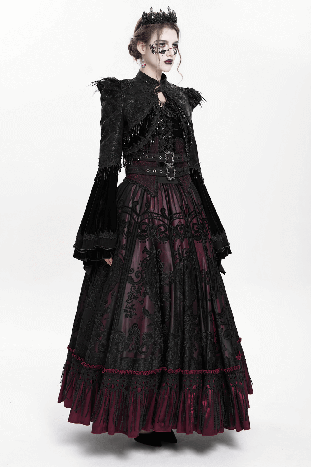 Gothic black bolero shrug with beaded bell sleeves, paired with a dramatic black and burgundy Victorian skirt.