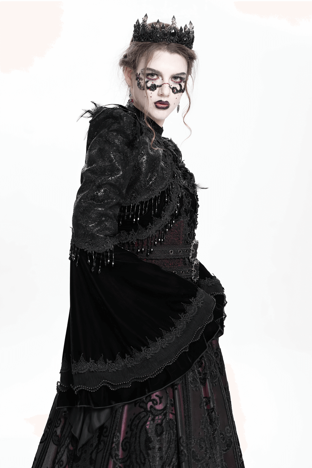 Gothic black bolero shrug with beaded bell sleeves, styled elegantly for a dark Victorian look.