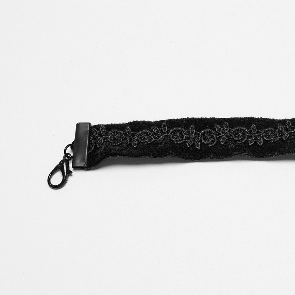 Gothic black choker featuring intricate lace design and clasp, perfect for a dark, elegant style.
