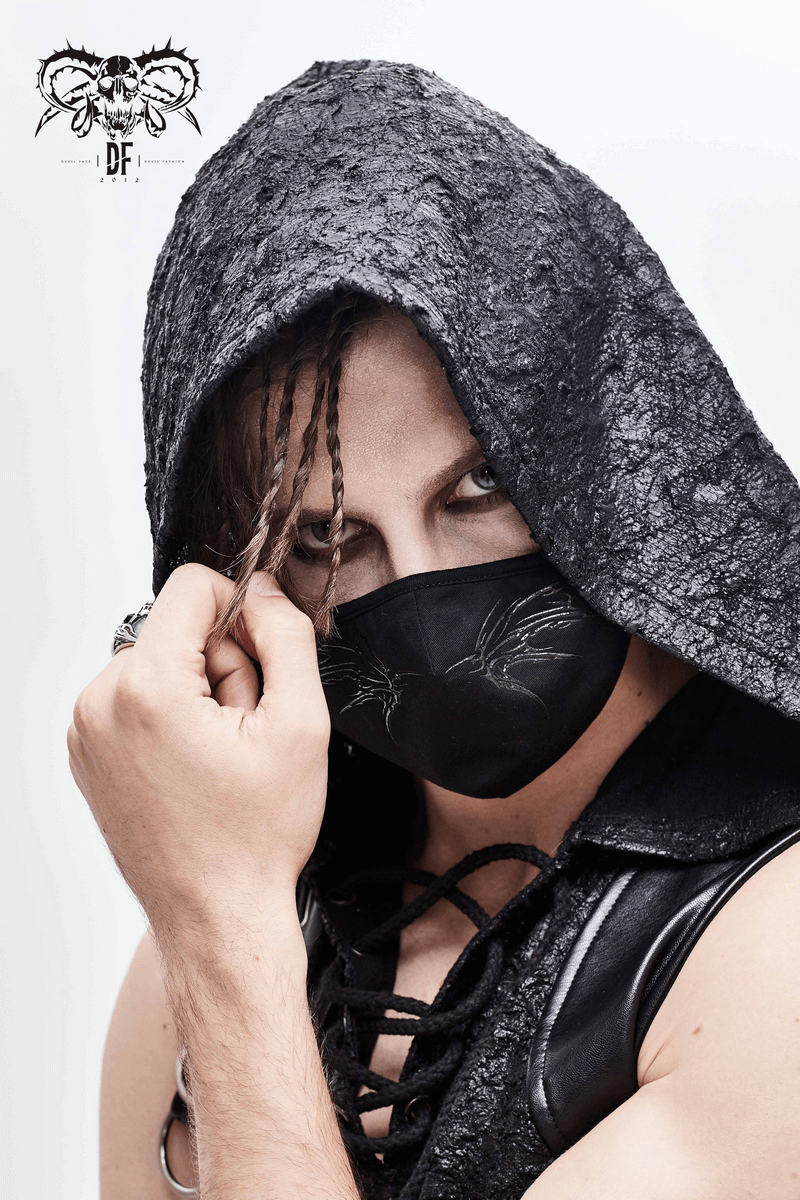 Model wearing a gothic black butterfly face mask with adjustable bands, showcasing a stylish look in dark fashion attire.