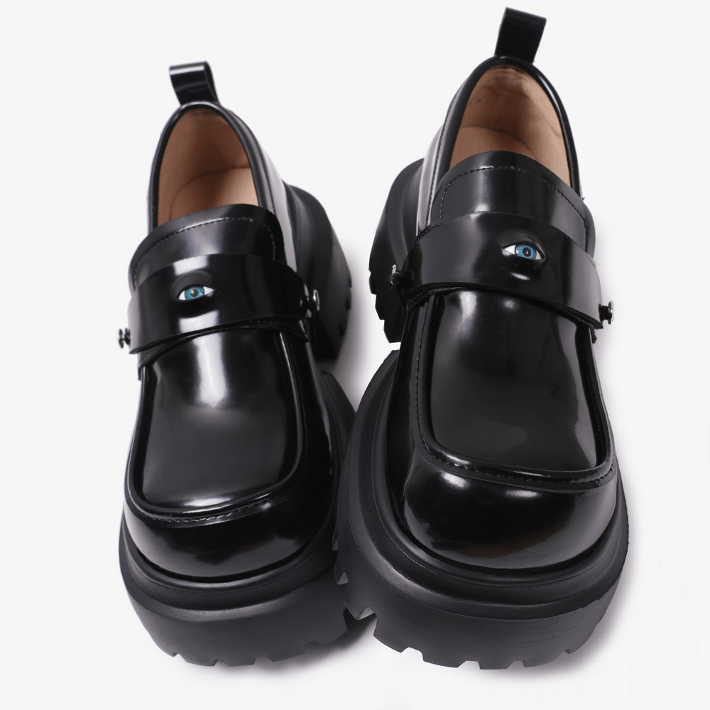 Gothic Black Chunky Platform Loafers with Eye Detail, glossy black punk grunge slip-on shoes with blue eye motif and lug soles