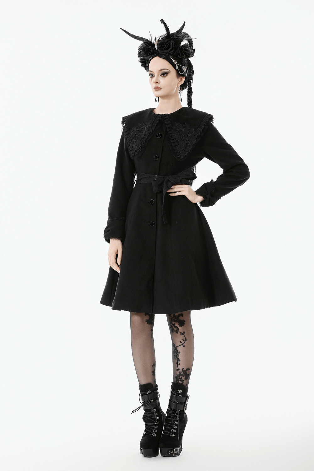 Gothic Black Coat with Lace Collar and Bow Detail worn by a model with dramatic style and accessories.