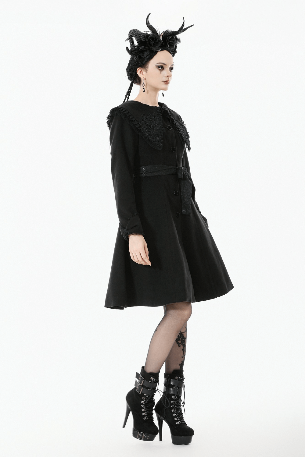 Gothic Black Coat with Lace Collar and Bow Detail worn by model, showcasing its elegant design and stylish details.