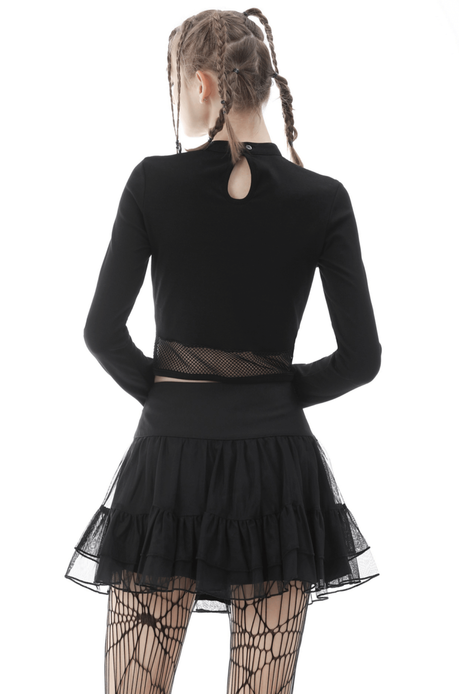 Back view of a black crop top with mesh detail, styled with a ruffled black skirt and fishnet tights, perfect for gothic fashion.