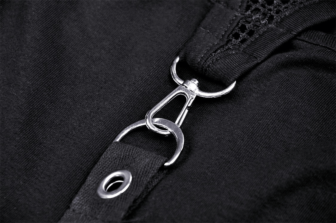 Close-up of metal rings and chains detail on a gothic black crop top showcasing edgy design elements.