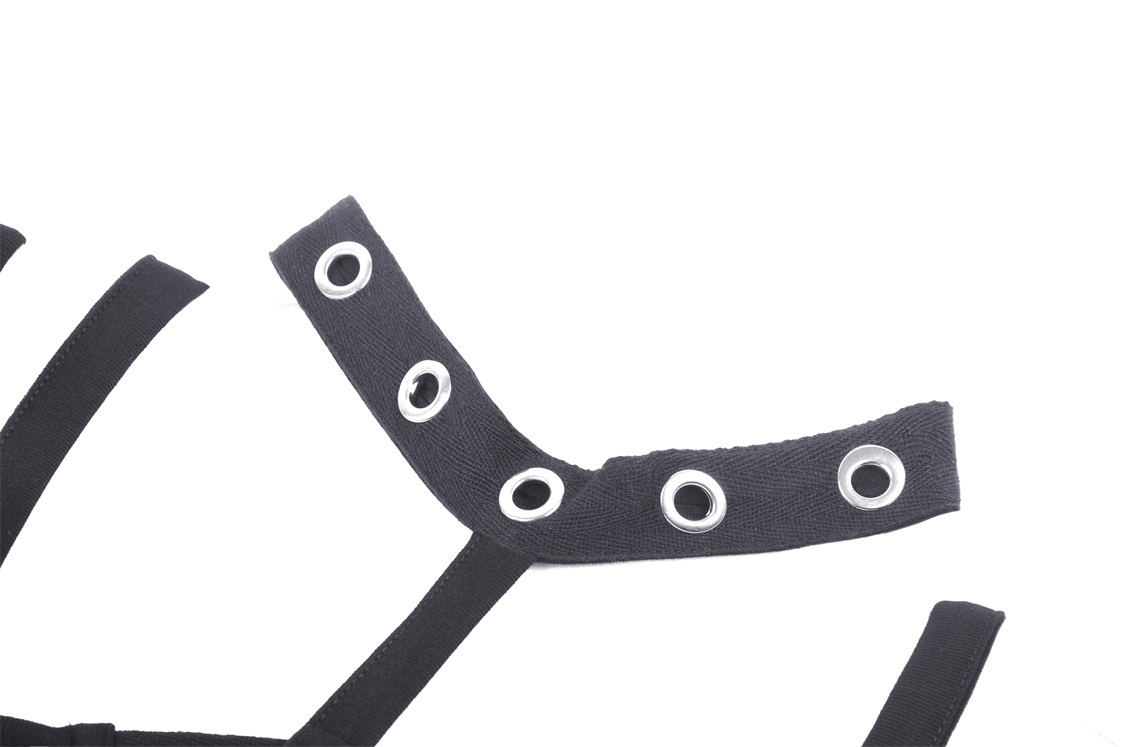 Close-up of Gothic black crop top harness detailing with metal grommets and edgy straps for dark fashion.