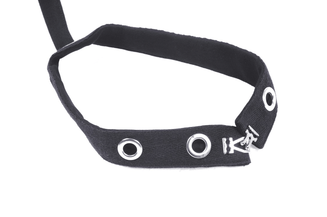 Gothic black harness strap with metal eyelets for edgy fashion styles and bold statements.