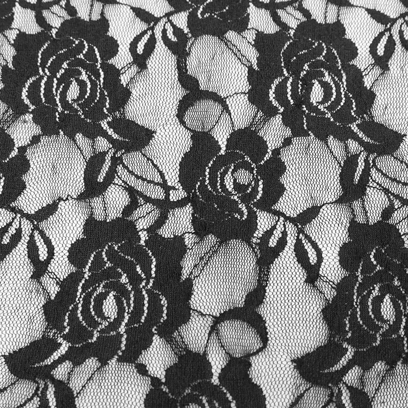Close-up of black lace fabric featuring elegant rose patterns, perfect for gothic fashion and stylish apparel.