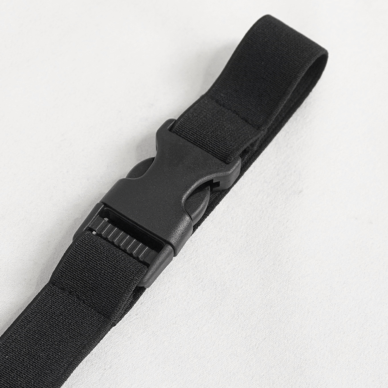 Close-up of a black elastic strap with a durable buckle for secure fastening.