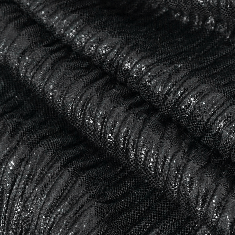 Close-up of textured black fabric with shimmering details, perfect for gothic fashion styles.