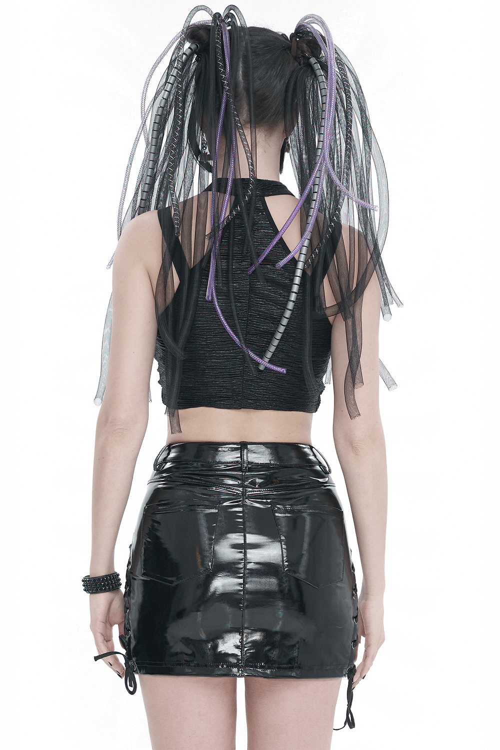 Back view of a gothic black cutout crop top paired with a shiny black mini skirt, showcasing edgy fashion details.