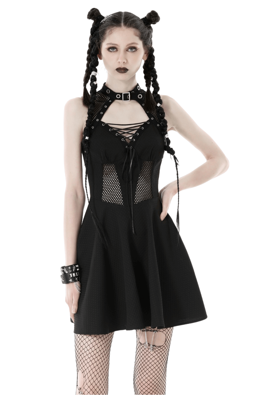 Gothic black mini dress with fishnet details, lace-up front, and rivet accents on a model with braids.