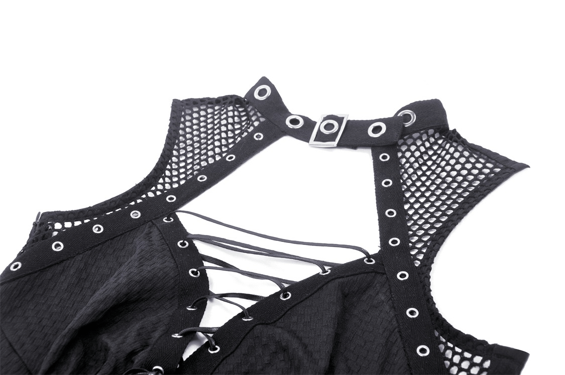 Close-up of gothic black dress with fishnet detail and lace-up front featuring rivet accents.