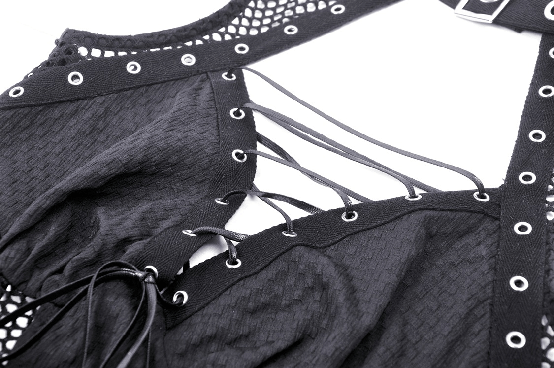 Close-up of gothic black dress featuring fishnet detail, lace-up front, and rivet accents for edgy punk style.