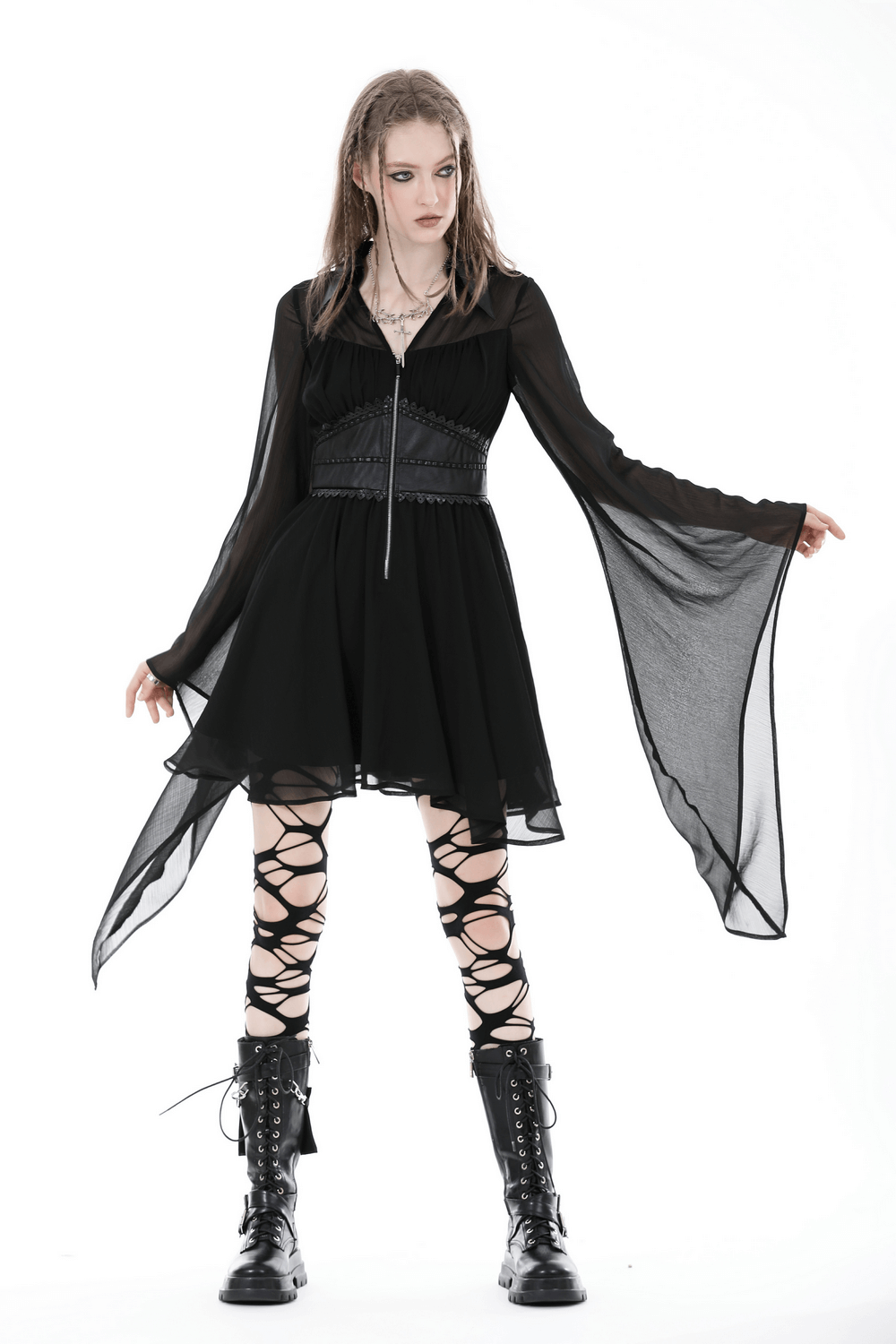 Gothic black dress with lace-up detail and flowy sleeves, styled with lace-up boots for an edgy look.
