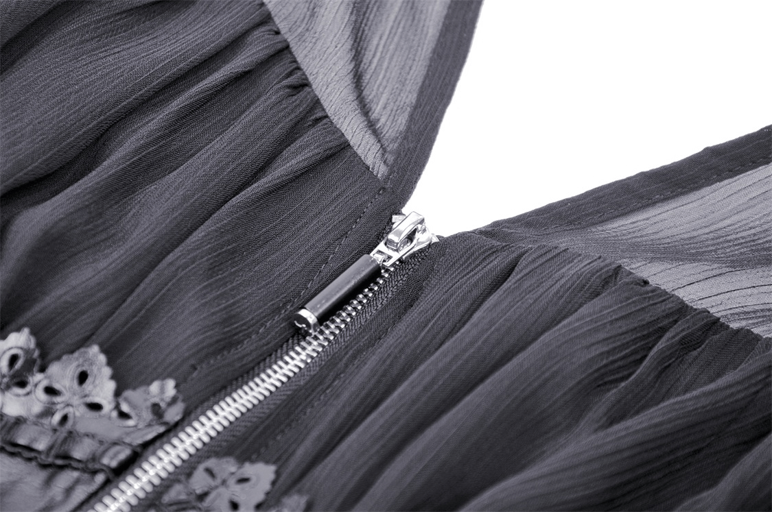 Close-up of Gothic Black Dress with lace detailing and zipper, showcasing elegant flowy fabric and corset styling.