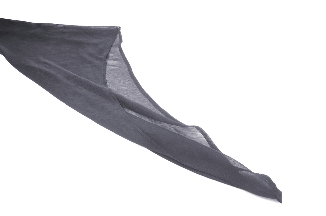 Flowing black sheer fabric draping elegantly, perfect for gothic fashion styling and dark aesthetic outfits.