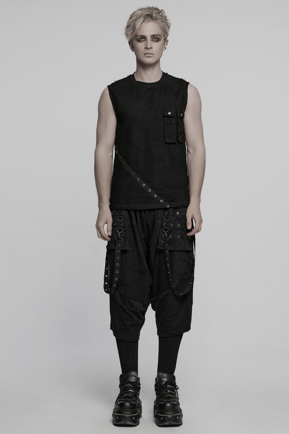 Gothic black drop crotch pants with eyelet straps and edgy sleeveless top for punk-inspired style.