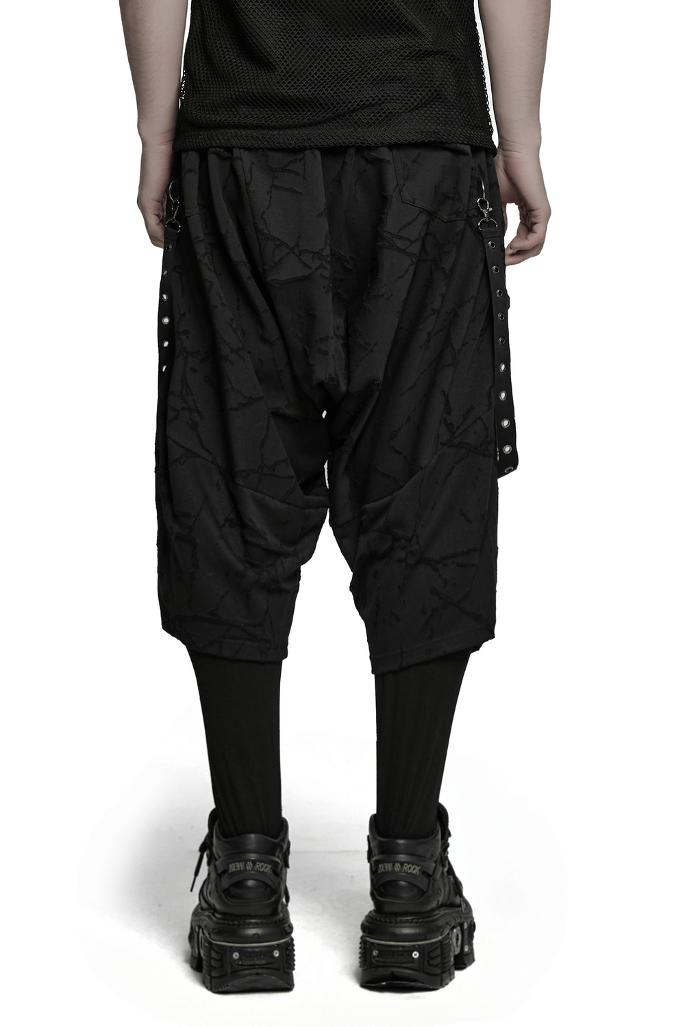 Back view of gothic black drop crotch pants with eyelet straps and D-ring accents for a punk-inspired look.