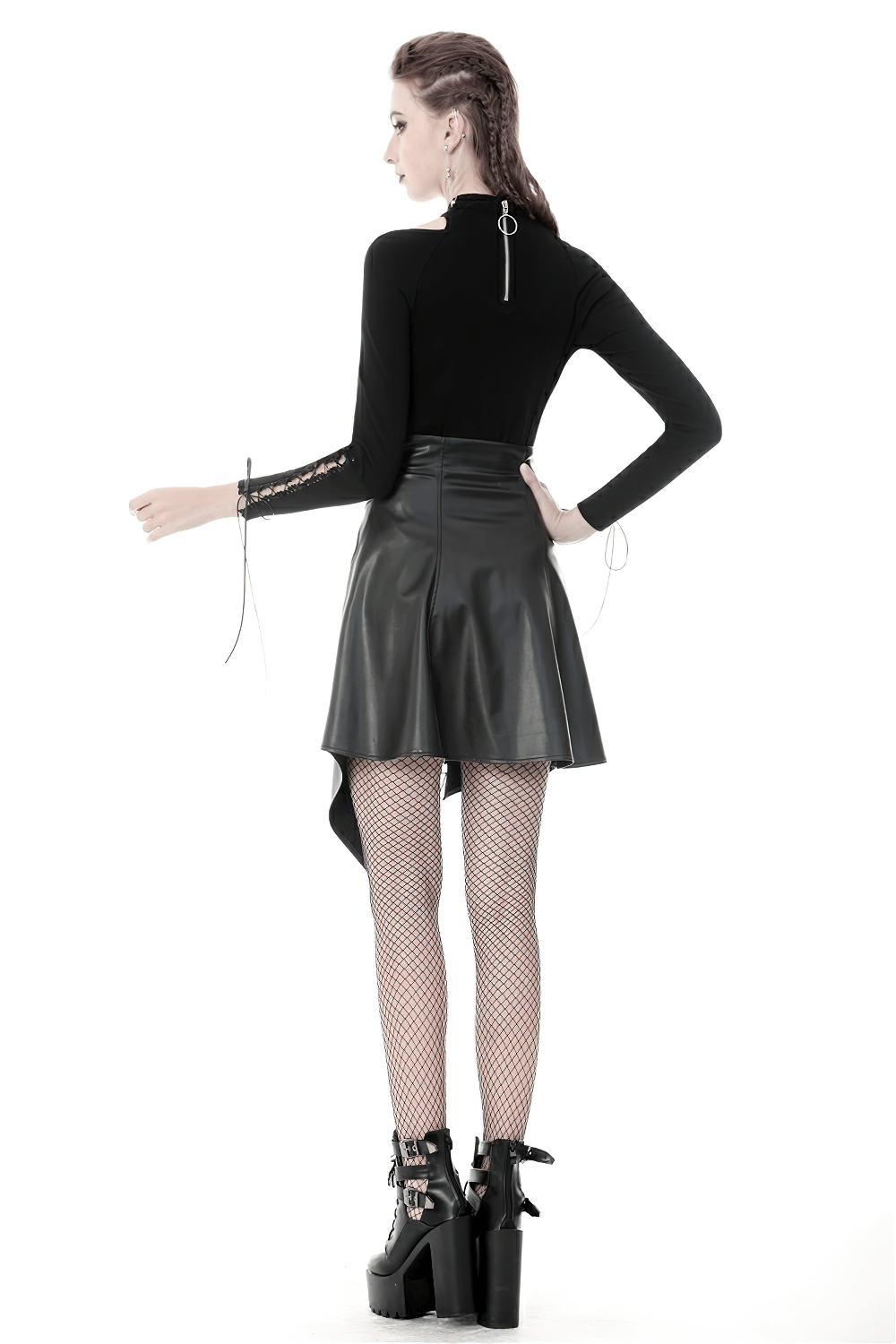 Model wearing a Gothic black faux leather asymmetric belted skirt with fishnet tights and stylish platform boots.