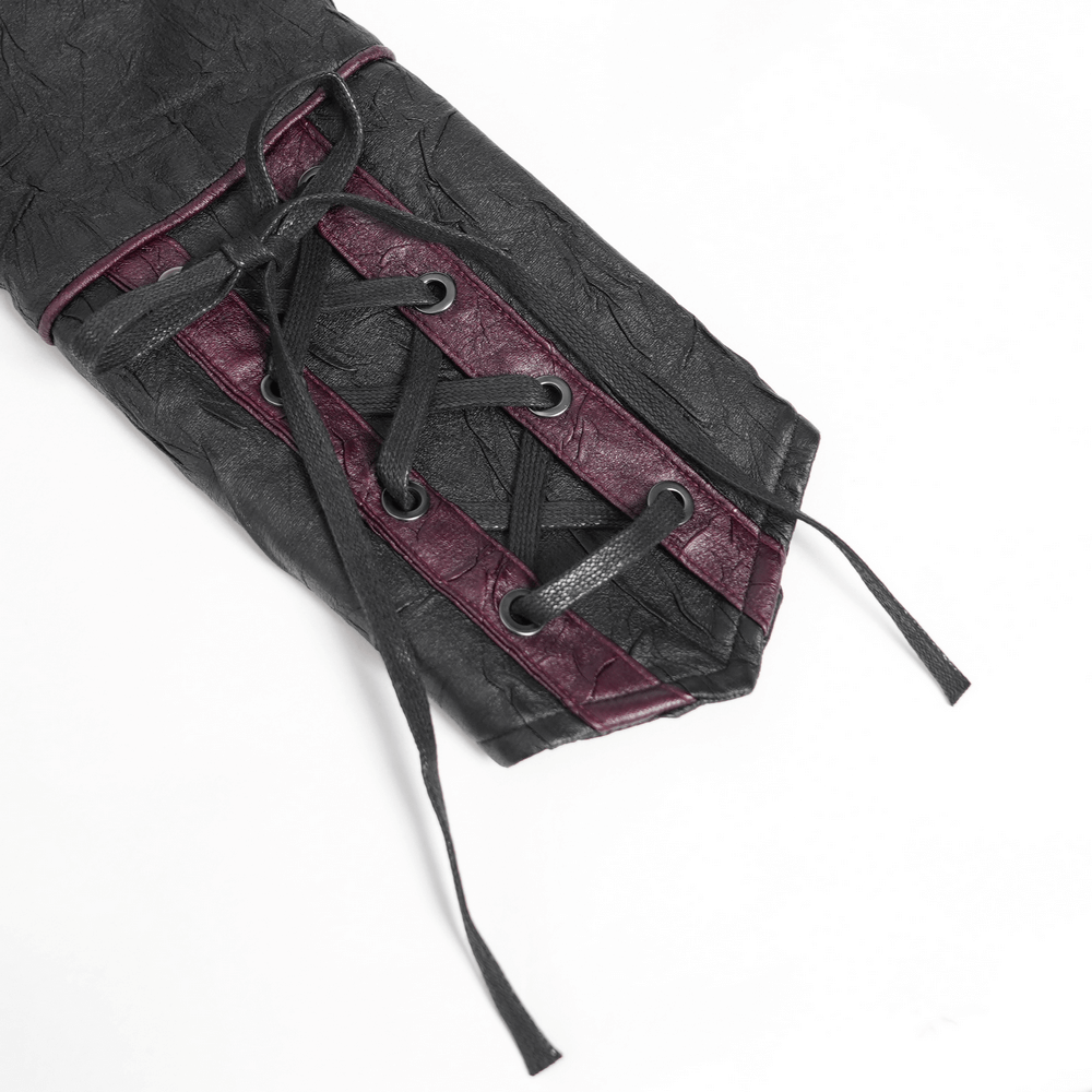 Close-up of lace-up sleeve detail on Gothic black faux leather jacket with deep red accents.