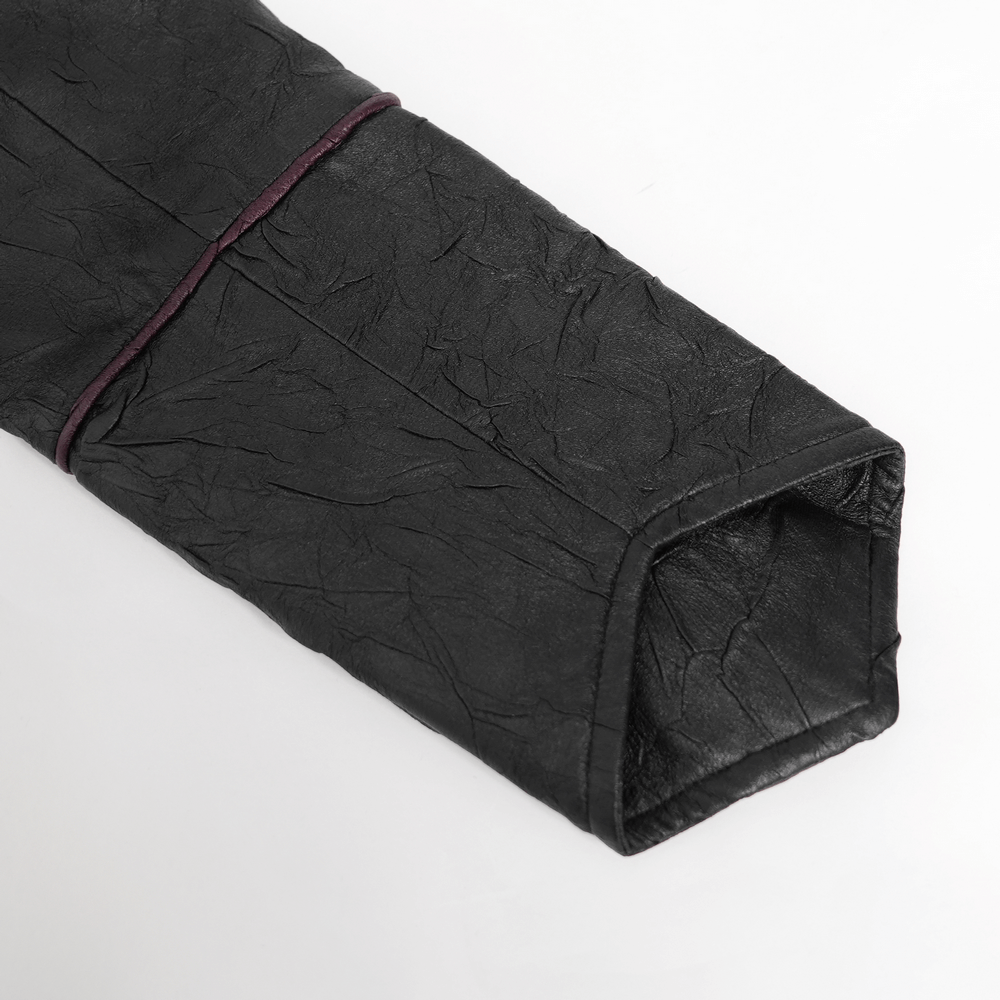 Close-up of gothic black faux leather jacket sleeve with deep red accent detailing.