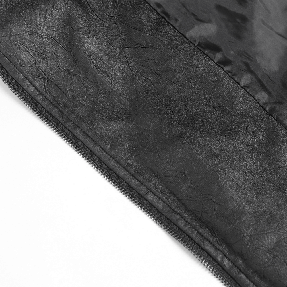 Close-up of black faux leather fabric showcasing texture for gothic punk jacket with zipper detail.
